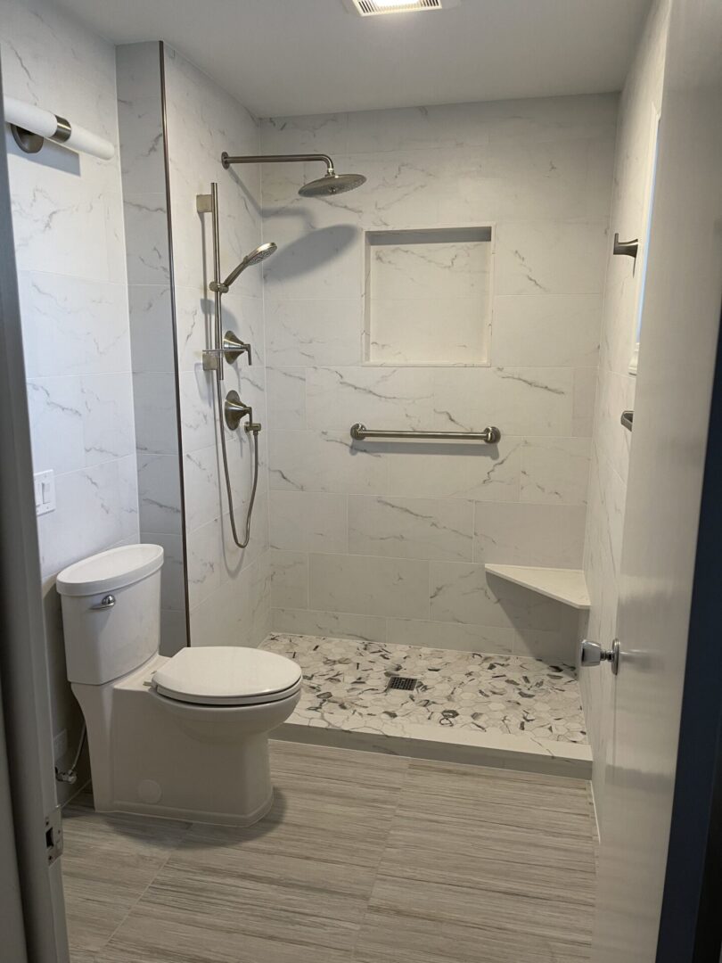 A bathroom with a walk in shower and toilet.